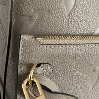 Bolsa Louis Vuitton Neverfull MM Monograma Empreinte Tourtelle