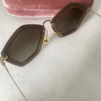 Óculos Miu Miu Nude 