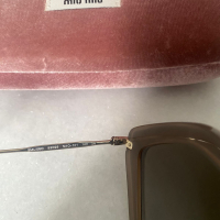 Óculos Miu Miu Nude 